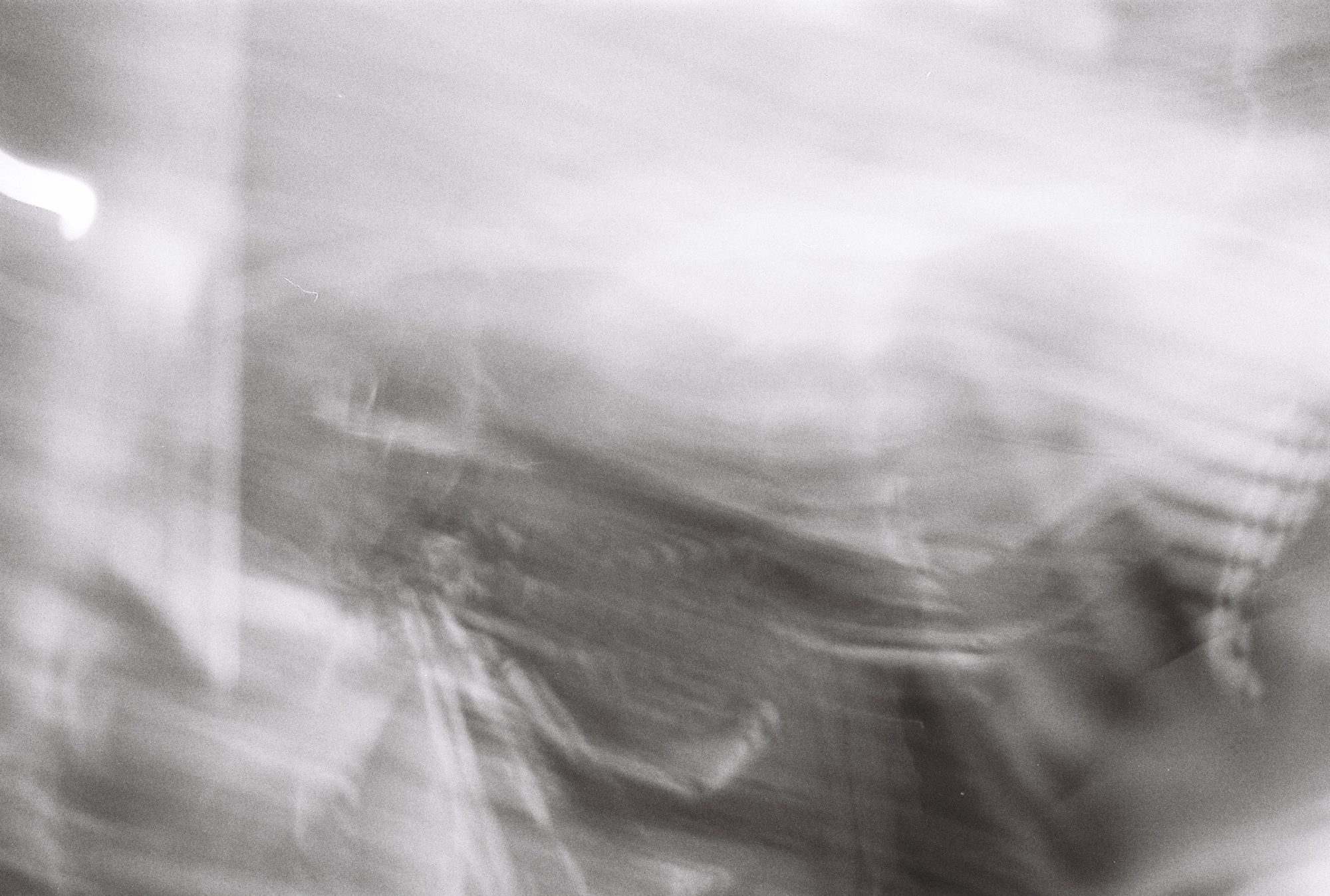 Pale, soft motion blur of fabric and light