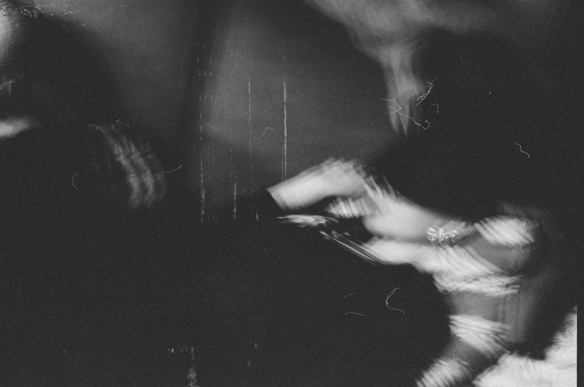 Dark motion blur of an arm with a sparkling bracelet